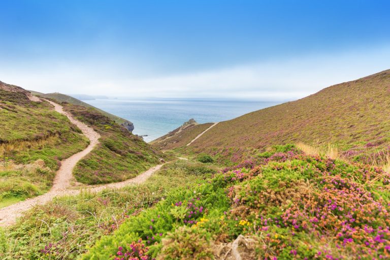 Coast path running by the sea at St Agnes and Chapel Port