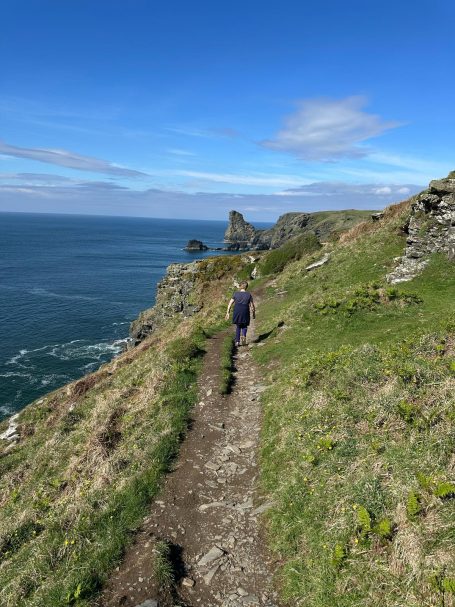 Walker on coast path near Boscastle